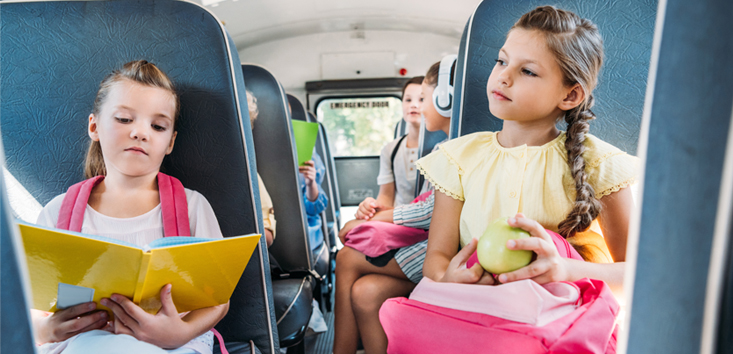 Girls riding the school bus